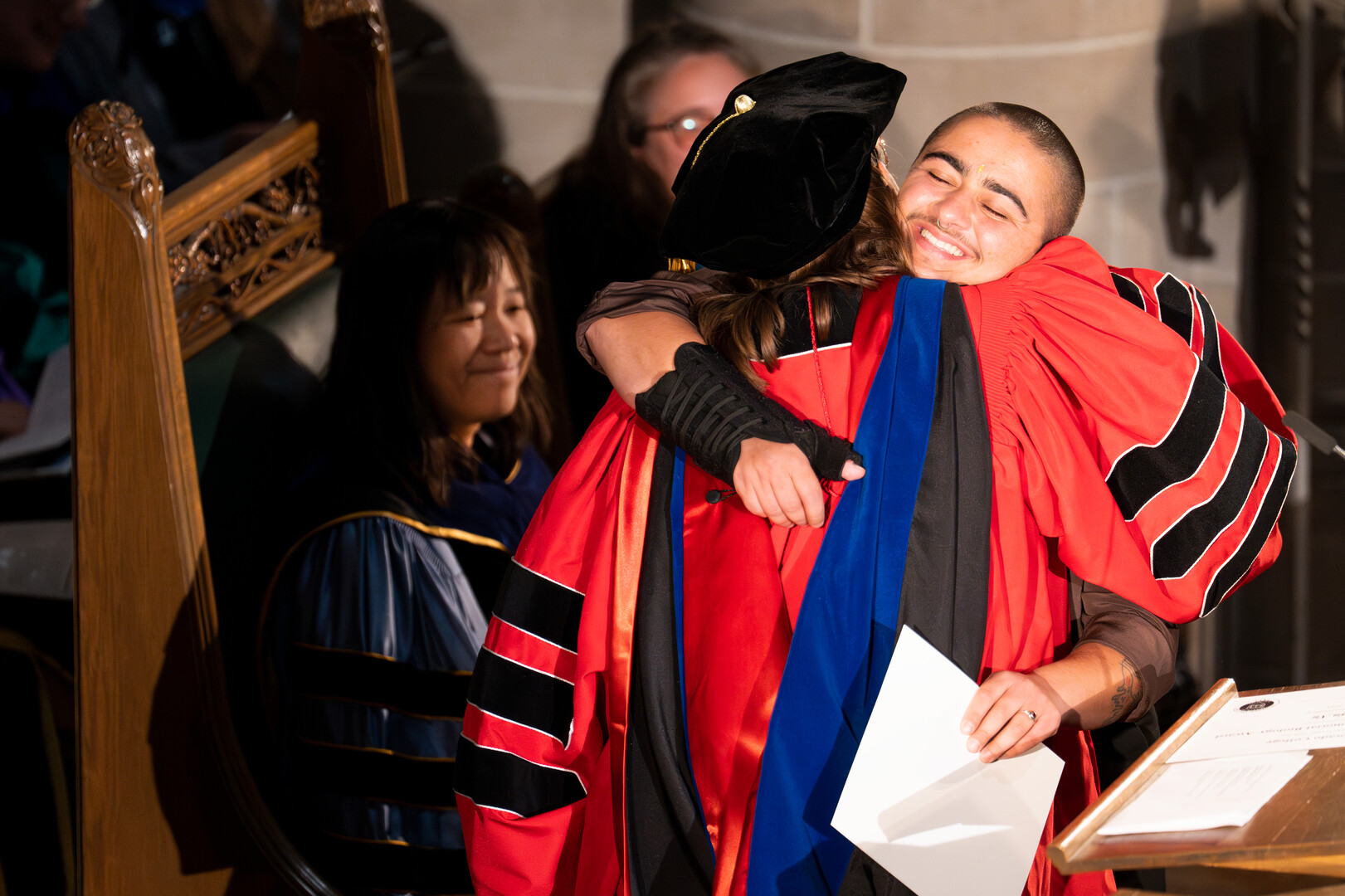 Student award winner hugs Rachel S. Jabaily as Colorado College honors outstanding students and faculty during its annual academics Honors Convocation on May 16, 2023. Photo by Lonnie Timmons III / Colorado College.